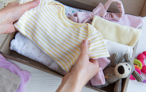 A bundle of baby girl clothes. Discover sustainable, affordable, gently-loved children's clothing bundles at Bundled, supporting parents and the environment with curated, high-quality options for newborns to toddlers at affordable and cheap price points.